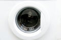 Close-up view of modern white washing machine round front door,interface. Interior view of laundry cabinet.Laundry