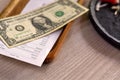 Close-up view, Money tip for service in the restaurant, Money dollar on wooden plate. Royalty Free Stock Photo