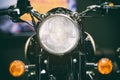 Close-up view of motorcycle headlight. Vintage classic Motorcycle headlight or head lamp. Royalty Free Stock Photo