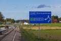 Close up view of motorway with road billboard with screen.