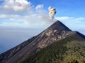 A close up view of mount fuego volcano during the day outside of Antigua, Guatemala.  Smoke and ash are rising out of the top or c Royalty Free Stock Photo
