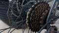 Mountain bike rusty and oily sprocket with gear and chain at the back tyre of bicycle