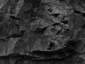 Black rock texture. Granite rock background. Mountain close-up. Dark mountain stone background. Rock climbing concept. Royalty Free Stock Photo