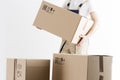 Close-up view of mover holding cardboard box isolated on white background. Concept o relocation into new house. Loader with boxes.