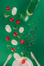 close up view of mozzarella cheese cherry tomatoes spinach spices and olive oil falling on plate Royalty Free Stock Photo
