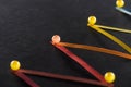 Close up view of multicolored abstract connected lines with pins on black background, connection and communication Royalty Free Stock Photo