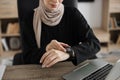 Close-up view of muslim female, putting her finger hand with smartwatch, measuring heartbeat rate Royalty Free Stock Photo