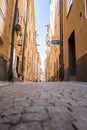 Close-up view of empty narrow alley amidst residential buildings in old town Royalty Free Stock Photo
