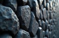 Close-up view of natural basalt column formation showing rough, angular texture. Stacked grey stone blocks create geometric Royalty Free Stock Photo
