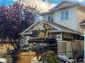 A close-up view of a neighbourhood garage roof, which bears the scars of recent accidental fire damage