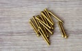 Close up view of new brass nails, some brass nails on a wood Royalty Free Stock Photo