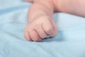 Close up view of newborn baby hand on a bed Royalty Free Stock Photo