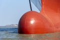 Close up view on the newly painted bulbous bow of big container ship. Royalty Free Stock Photo