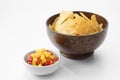 Close up view of nice red salsa and corn chips on white background. Royalty Free Stock Photo