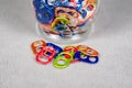 Close up view of a number of multi colored can pull tabs lying loose Royalty Free Stock Photo