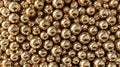Close-up view of numerous reflective golden spheres packed tightly