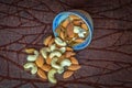 Close up view of nuts cashew almonds raisins in a bowl on wooden table Royalty Free Stock Photo