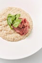 Close-up view oatmeal porridge with lowfat ham and fresh spinach. Royalty Free Stock Photo