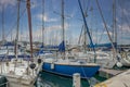 Close up view of the Ocean Village Marina with lots of yachts, tourist boats moored to the waterfront in Gibraltar.