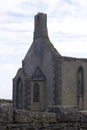 Close up view of an old abandoned church in rural Ireland with stone wall Royalty Free Stock Photo