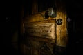 Close up view of old antique wooden door inside dark room. Selective focus Royalty Free Stock Photo