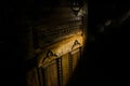 Close up view of old antique wooden door inside dark room. Selective focus Royalty Free Stock Photo