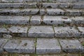 Close up view of old dirty grunge stone steps leading upward