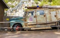 Close up view of old rusty fire car on mountain landscape on background. .