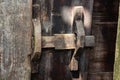 Close up view of the old rusty padlock on a aged gray wooden door Royalty Free Stock Photo