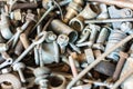 Close-up view of old used spare part, rust bolts and knots many sizes