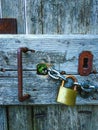 Close up view of an old wooden door with a padlock Royalty Free Stock Photo