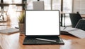 Close-up view of open blank screen laptop computer with office supplies in modern office Royalty Free Stock Photo