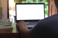 Close-up view of open blank screen laptop computer with office supplies on wood table Royalty Free Stock Photo