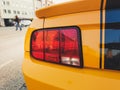 Close up view on an orange and black mustang Royalty Free Stock Photo