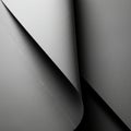 Close-up view of overlapping sheets of matte grey paper, creating a layered texture. T Royalty Free Stock Photo