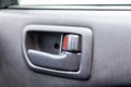 A close-up view of a part of the interior of a modern car with a view of a door handle after dry cleaning. Auto service industry Royalty Free Stock Photo