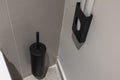 Close up view of part of modern bathroom in black and gray tones.