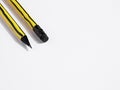 Close up view of a pencil tip and eraser on white background with copy space