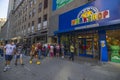 Close up view of people on street near entrance of build a bear workshop. New York,