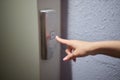A video displaying a closeup view of someone pushing elevator buttons in an office building Royalty Free Stock Photo