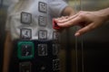 A video displaying a closeup view of someone pushing elevator buttons in an office building Royalty Free Stock Photo
