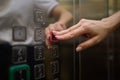 A video displaying a closeup view of someone pushing elevator buttons in an office building Royalty Free Stock Photo