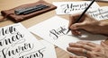 Artistic Calligraphy Practice: Detailed Hand Lettering on White Paper Royalty Free Stock Photo