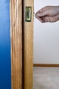 Close up view of a person unlocking pocket door