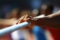 A close up view of a persons hand firmly gripping a bar, showcasing their strength and determination in fitness training, Close-up