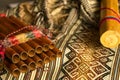 Close up view of Peruvian pan flute and rain stick on traditional colorful textile. Concept of traditional Andean music Royalty Free Stock Photo