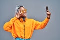 Close up view photo of modern cute afro american woman make photos moment video call have earphone yellow pullover isolated over