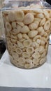 Close-up view of pickled salak fruit in a large jar?