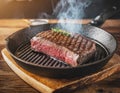 A close-up view of a piece of Wagyu steak cooking in a hot pan on a wooden table