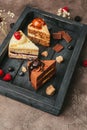close-up view of pieces of delicious cakes on wooden